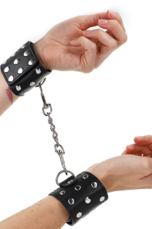 KINK - WRIST RESTRAINTS WITH SNAP FASTEN FULL OF RIVETS BLACK ADJUSTABLE 19-24 CM X 5.5 CM